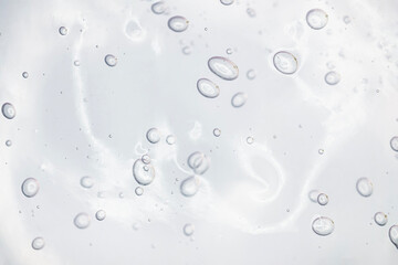 Water gel cosmetic serum, hair care or beauty calming gel smudge abstract background