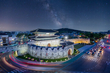 Hwaseong Fortress at night, Traditional Architecture of Korea at Suwon and the Milky Way in the background, South Korea.