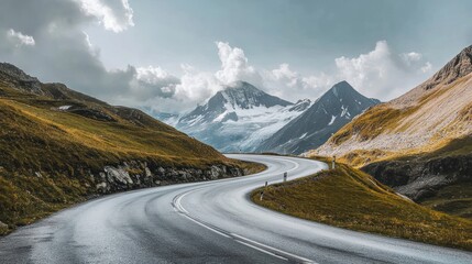 The two-lane road passes through valleys and winds along the misty foothills of the Alps.