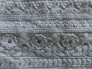 Intricate multi white thread floral border with golden tikki on georgette fabric