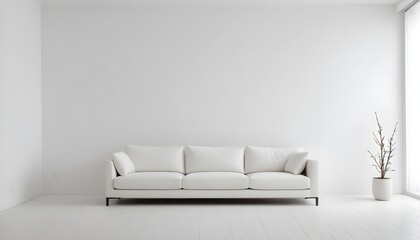 A white sofa in a minimalist white room with a plain white wall