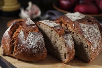 A loaf of rye bread in low key