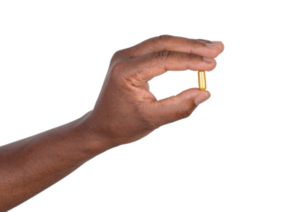 Man holding a pill in his fingers, isolated on white or transparent background