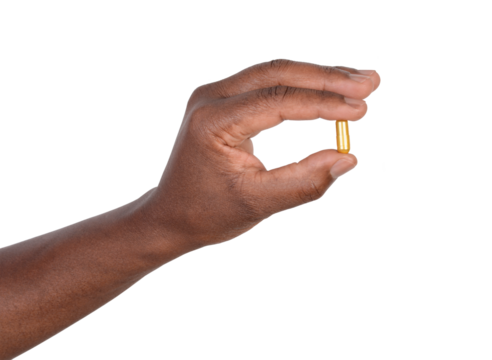 Man holding a pill in his fingers, isolated on white or transparent background - Powered by Adobe