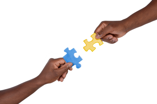 Man trying to match pieces of jigsaw puzzle, isolated on white background