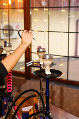 Colorful hookah on bokeh background close up