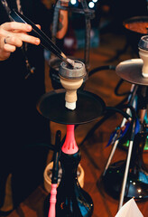 Colorful hookah on bokeh background close up