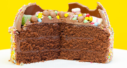 A chocolate cake with colorful sprinkles on top