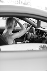 Young woman driver hands close up hold steering wheel car.