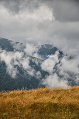 Foggy Mountain Landscape With Rolling Clouds Over Lush Greenery. Borzhava range during summer. Carpathian mountains, Ukraine