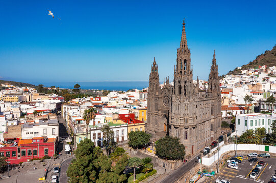 Aerial view of the Parroquia de San Juan Bautista de Arucas church in Arucas town, Gran Canaria, Canary Islands, Spain. Historic Neo-Gothic cathedral in Arucas.