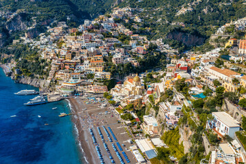 Aerial view of Positano with comfortable beach and blue sea on Amalfi Coast in Campania, Italy....