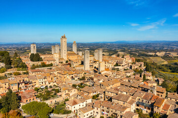 Naklejka premium Town of San Gimignano, Tuscany, Italy with its famous medieval towers. Aerial view of the medieval village of San Gimignano, a Unesco World Heritage Site. Italy, Tuscany, Val d'Elsa.