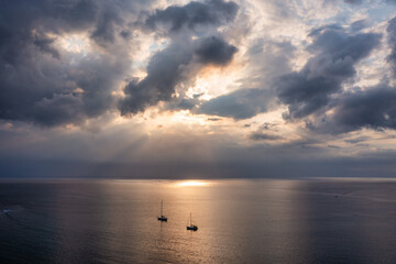 Drone flying over sea in a beautiful sunset in Indian Ocean, Mauritius. Aerial drone shoot. Sunrise over the sea. Colorful sunset on the Indian Ocean, Mauritius.