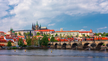 Obraz premium Prague scenic spring view of the Prague Old Town pier architecture Charles Bridge over Vltava river in Prague, Czechia. Old Town of Prague with the Castle in the background, Czech Republic.