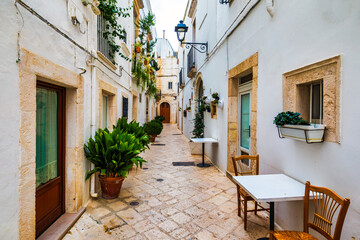 Scenic sight in Locorotondo, Bari Province, Apulia (Puglia), Italy. Characteristic streets in the Locorotondo in Puglia, Italy. Locorotondo is a town of the Metropolitan City of Bari, Apulia, Italy.