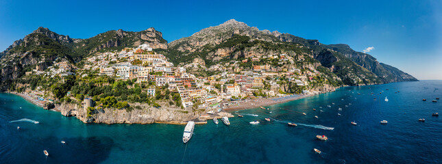 Aerial view of Positano with comfortable beach and blue sea on Amalfi Coast in Campania, Italy. Positano village on the Amalfi Coast, Salerno, Campania. Beautiful Positano, Amalfi Coast in Campania.