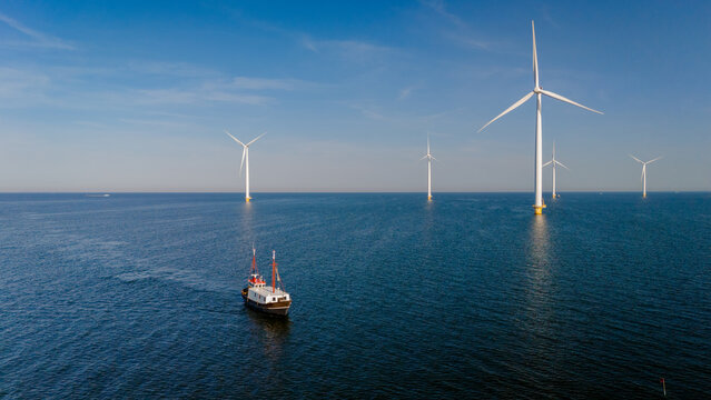 Tranquil Windmill Park at Twilight Over the Calm Waters of the Netherlands