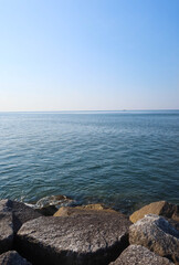 Stone rock with blue sky and sea on a good weather day