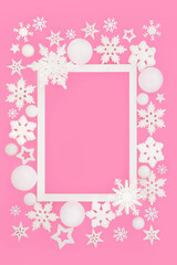 Christmas festive snowflake star decorations magical background border on pink, white frame. Festive design for Noel, Yule Xmas holiday season. Gift tag, label, greeting card.