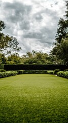 Naklejka premium A serene garden features meticulously arranged greenery, colorful plants, and winding paths under a clear sky, inviting relaxation and exploration