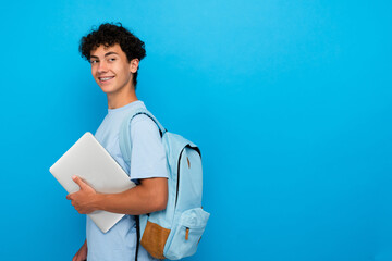 Attractive smiling boy guy high school male pupil student teenager in casual clothing with backpack...