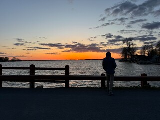 Fototapeta premium silhouette of a person on a pier