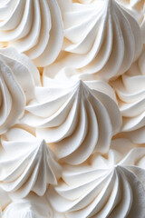 Macro shot of the texture of a pavlova highlighting the crisp meringue shell with a soft marshmallow like center 