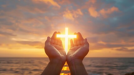 A serene image of hands holding a glowing cross at sunrise, symbolizing hope and faith against a beautiful ocean backdrop.