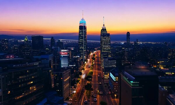 Time-lapse of a bustling cityscape with skyscrapers and busy streets