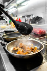 Close-up of shrimp being sautéed in pan, with steam rising. Perfect for culinary themes, showcasing the cooking process and fresh seafood. Ideal for food blogs, recipe websites, or culinary magazines.