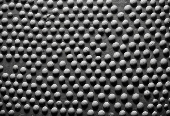 Grainy black and white image with a textured, dotted pattern across the entire frame 