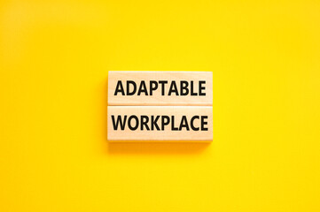 Adaptable workplace symbol. Concept words Adaptable workplace on beautiful wooden block. Beautiful yellow paper background. Business Adaptable workplace concept. Copy space.