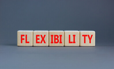 Flexibility symbol. Concept word Flexibility on beautiful wooden blocks. Beautiful grey background....