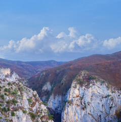 mountain canyon under a blue cloudy sky