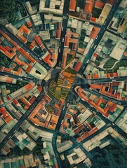 Obraz premium Aerial view of a vibrant cityscape with colorful buildings arranged radially around a central plaza, showcasing urban planning and diverse architecture.