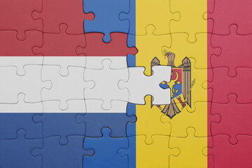 puzzle with the colourful national flag of moldova and flag of netherlands.