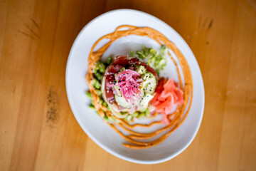 Tuna Poke Rice tower at gourmet beachfront restaurant 