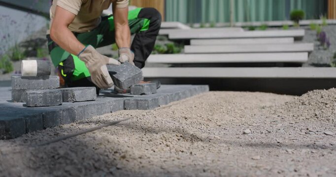 Laying Pavers in a Modern Garden Landscape in Early Morning