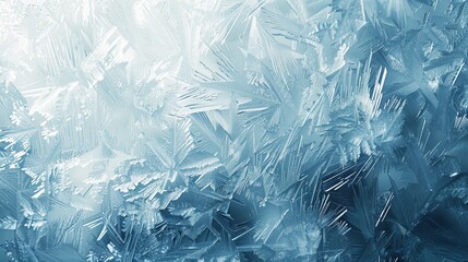 Frosty and intricate ice patterns on a glass surface