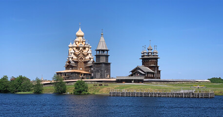 Fototapeta premium View of The Church of the Transfiguration, The Church of the Intercession and Belfry of the Kizhi Pogost, Karelia, Russia, June 2019