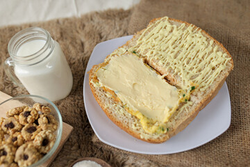 Bread with scrambled egg sandwich on a plate for breakfast and coffee break	
