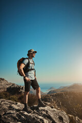 Fototapeta premium Man, hiking and mountain on peak outdoor for fitness travel, adventure view and backpack journey in summer. Male hiker, backpacking and trekking sky mockup for cardio exercise of rock climbing health