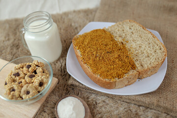 Bread with chicken floss on a plate for breakfast. Homemade bread with dried shredded chicken