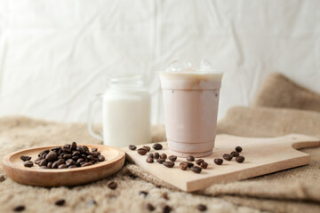 Delicious iced coffee, mocca, and chocolate drinks with coffee beans on white wooden table