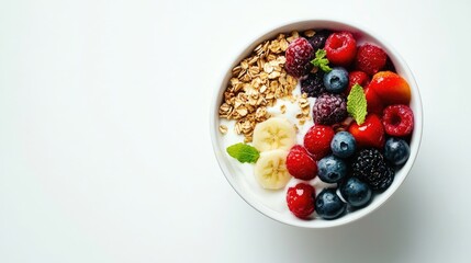 Top-down view of a wholesome breakfast bowl with Greek yogurt, granola, and colorful mixed fruits on a white background