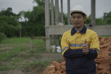 Professional architect engineer with hard hat and blueprint at building construction site house building permit background. Architects looking at blueprints. Construction and engineering industry