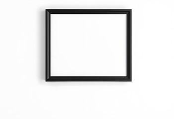 A black picture frame with a plant next to it on a white background