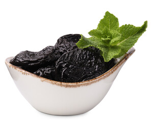 Tasty dried plums (prunes) and mint leaves on white background