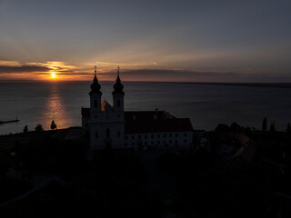 Aerial skyline view of the famous Benedictine Monastery of Tihany (Tihany Abbey) with beautiful colourful sky and clouds at sunrise